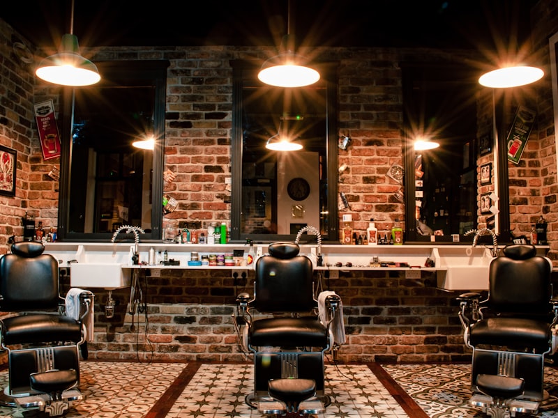 A barber working a clipper fade on a client